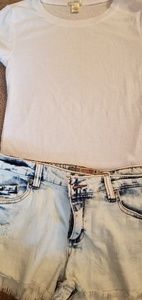 White medium tee and stonewashed shorts
